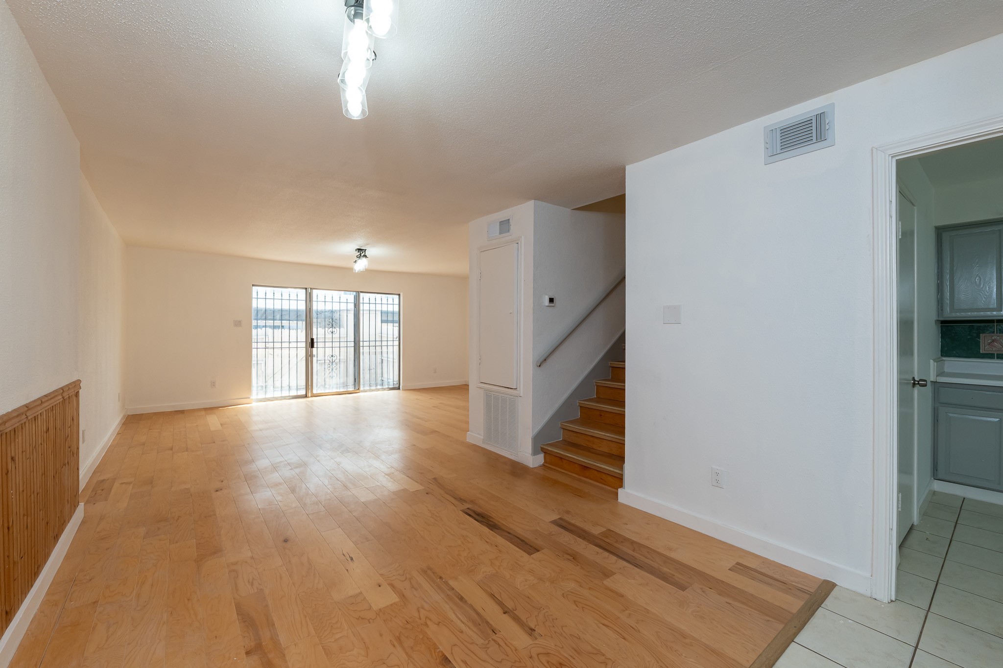 8486 Ariel Street Houston, TX 77074 - Photo 24 of 45 wooden floor in an empty room with a window