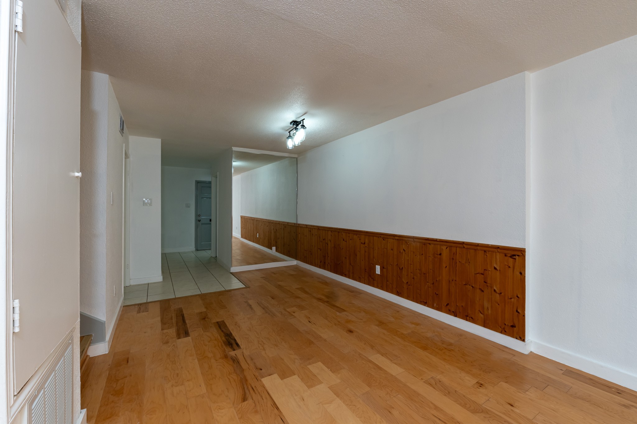 8486 Ariel Street Houston, TX 77074 - Photo 25 of 45 a view of room with wooden floor