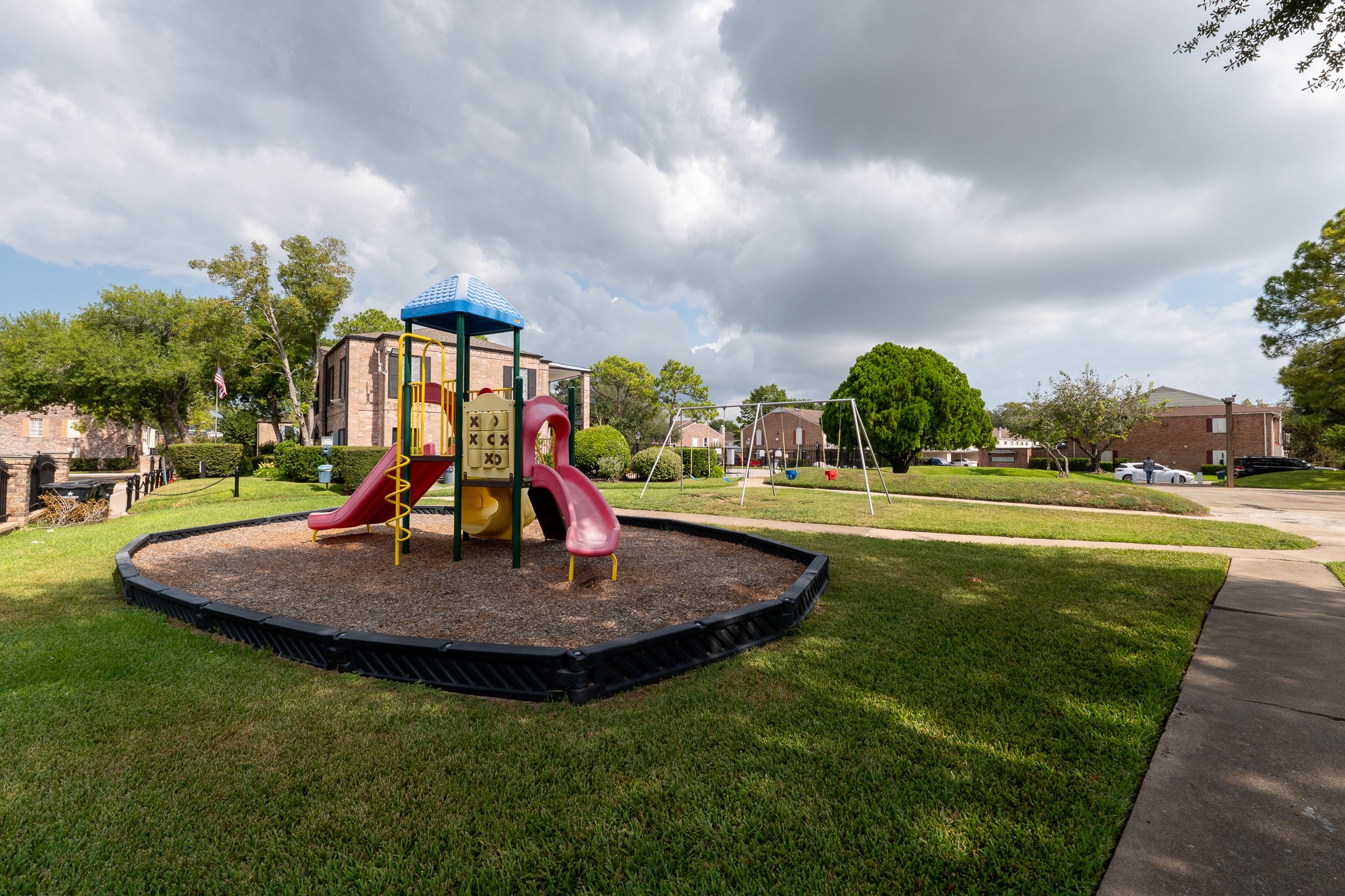 8486 Ariel Street Houston, TX 77074 - Photo 3 of 45 a view of a fountain in front of a house with a yard