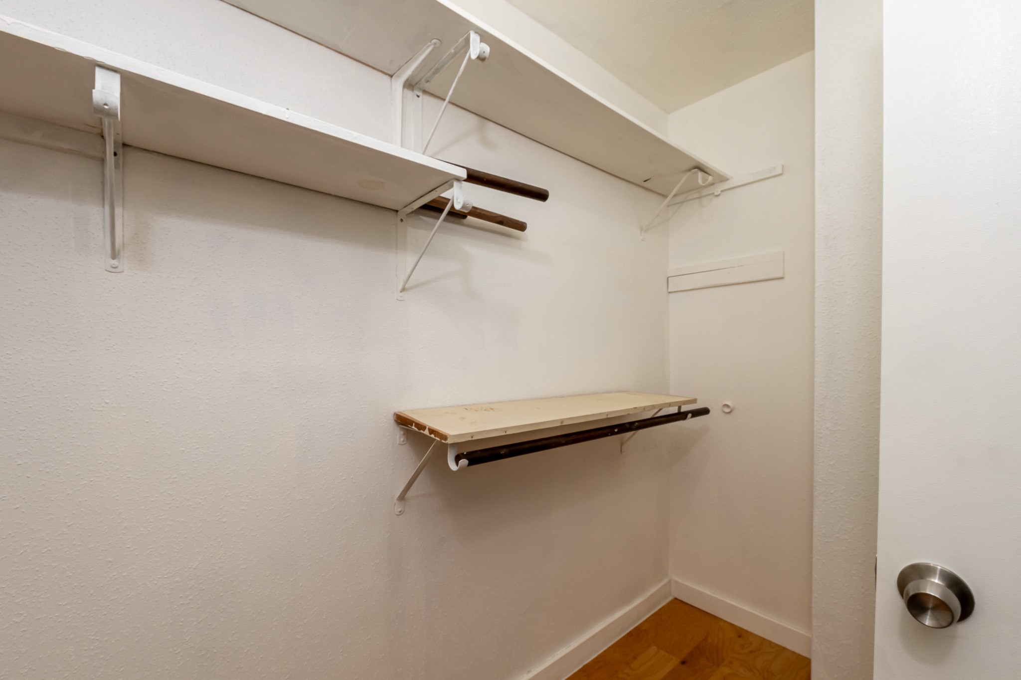 8486 Ariel Street Houston, TX 77074 - Photo 34 of 45 a view of a room with racks on the wall