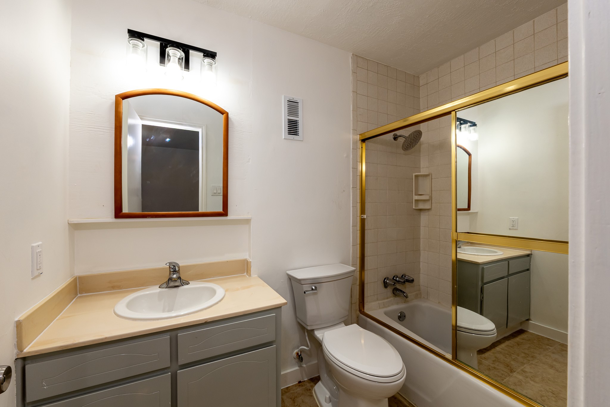 8486 Ariel Street Houston, TX 77074 - Photo 35 of 45 a bathroom with a toilet sink shower and mirror