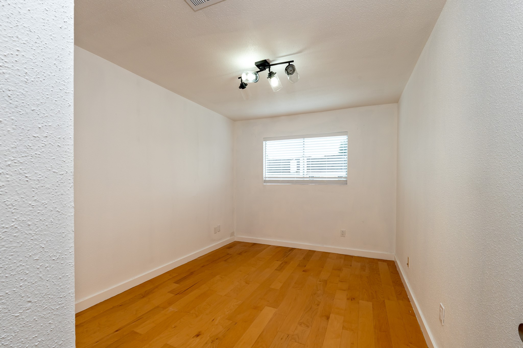 8486 Ariel Street Houston, TX 77074 - Photo 39 of 45 an empty room with a window
