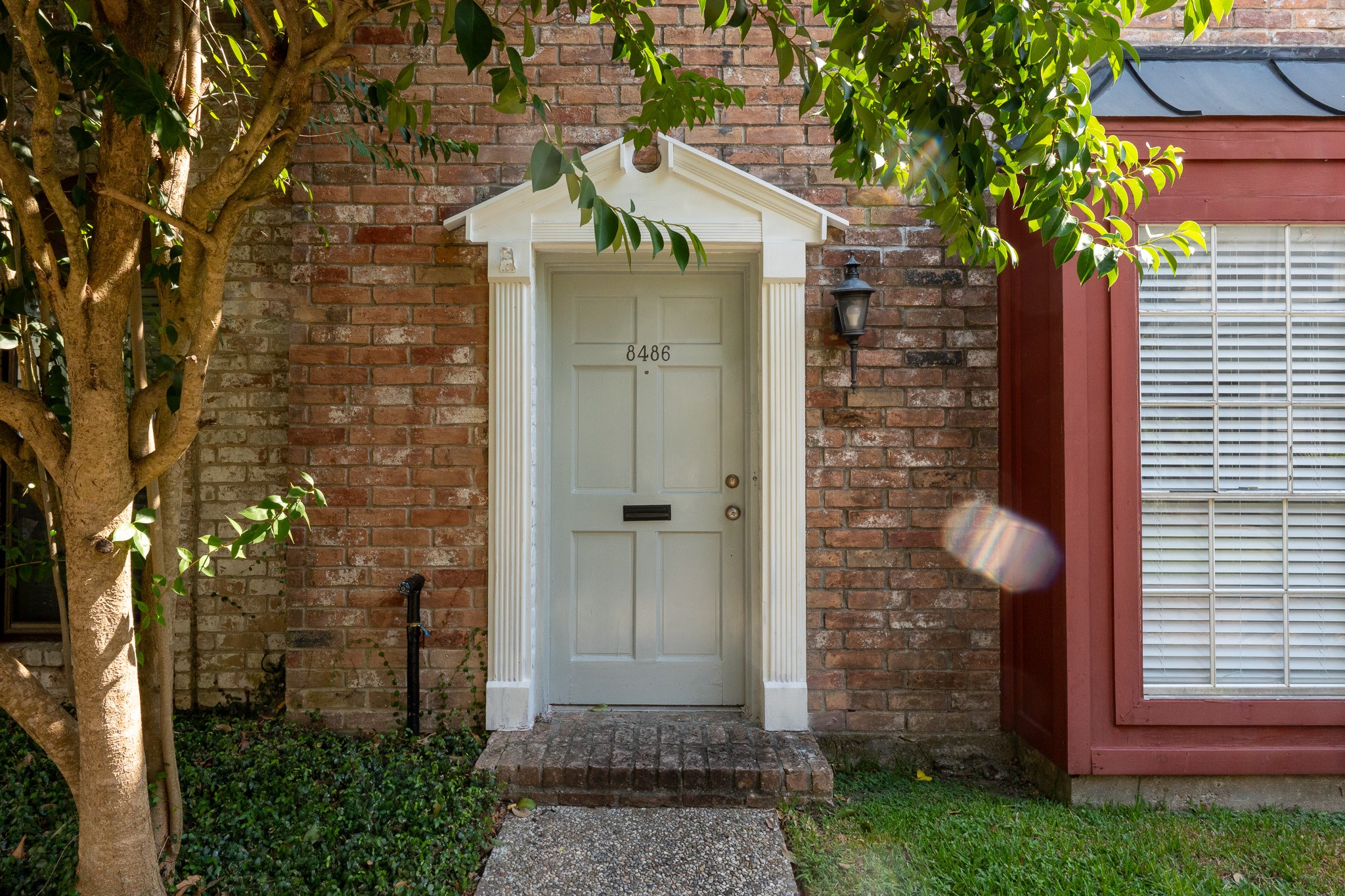 8486 Ariel Street Houston, TX 77074 - Photo 7 of 45 a front view of a house with a garden