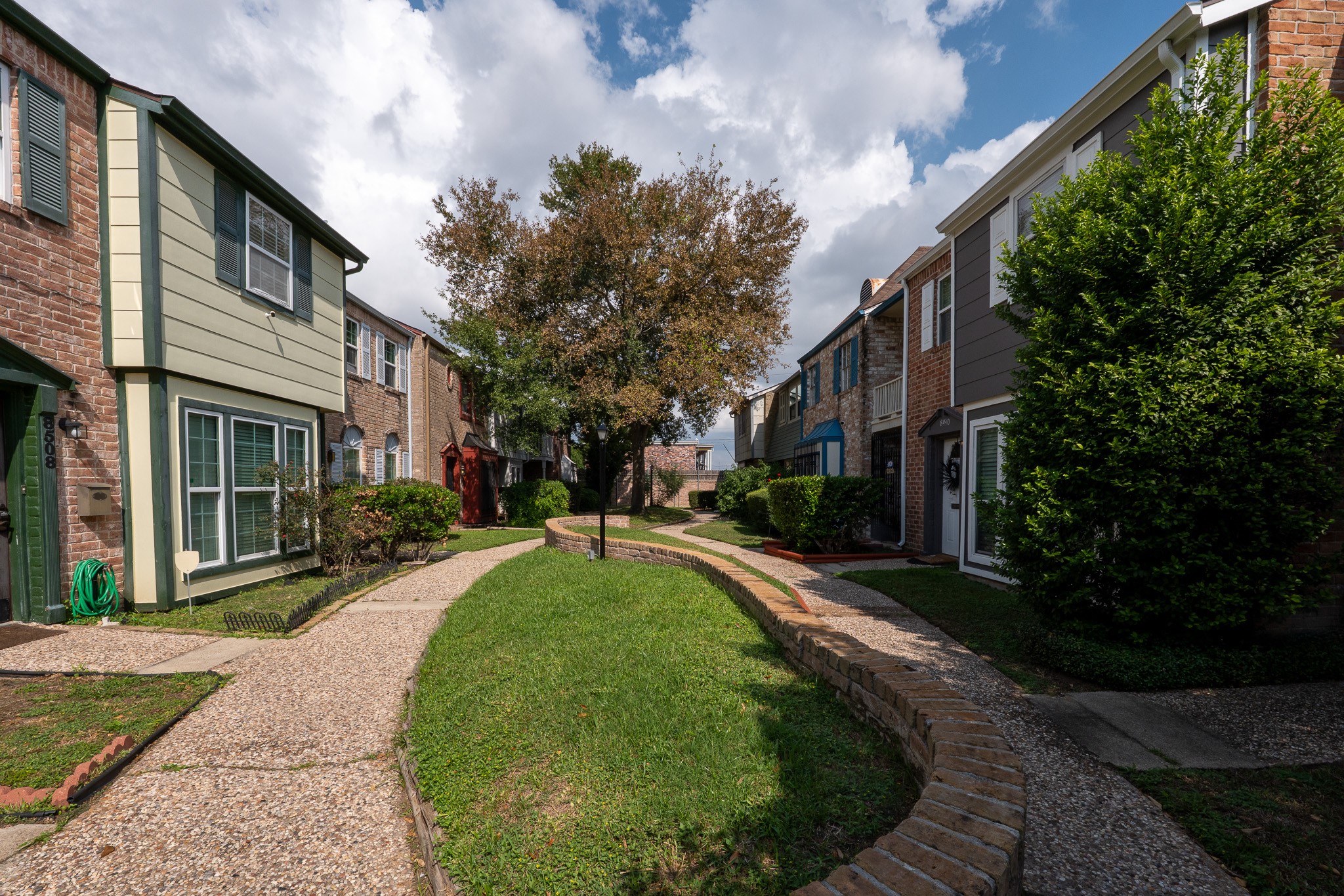 8486 Ariel Street Houston, TX 77074 - Photo 8 of 45 a view of a building with a garden