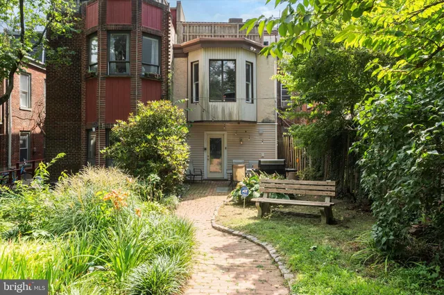 a view of house with yard outdoor seating and entertaining space