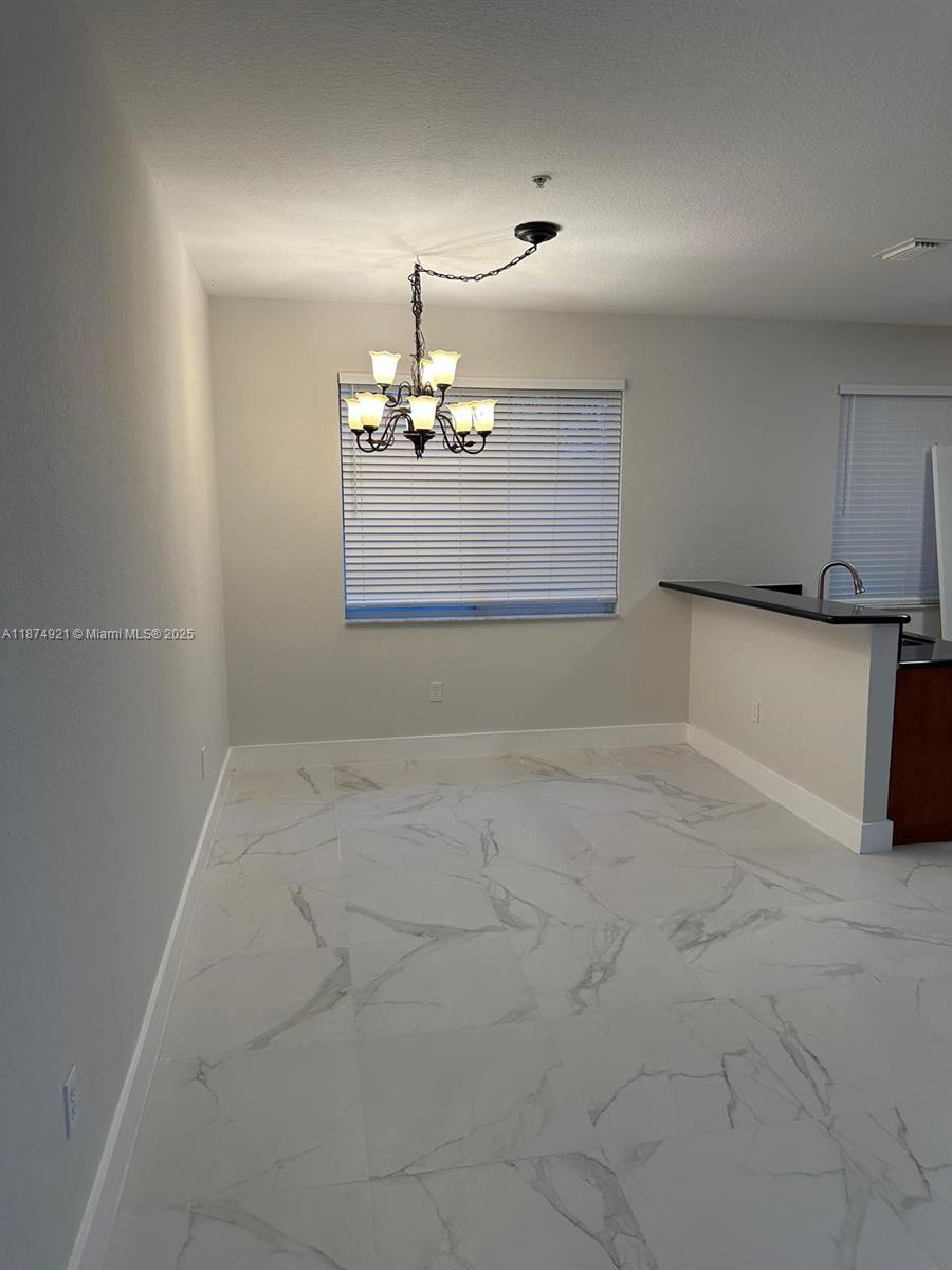12421 Southwest 50th Court, Unit 337 Miramar, FL 33027 - Photo 20 of 46 a view of a livingroom with a fireplace