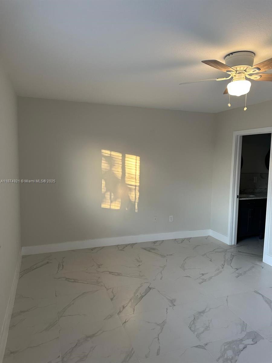 12421 Southwest 50th Court, Unit 337 Miramar, FL 33027 - Photo 22 of 46 a view of an empty room with a window