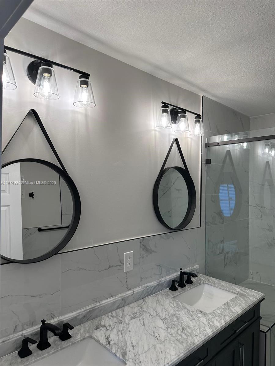 12421 Southwest 50th Court, Unit 337 Miramar, FL 33027 - Photo 24 of 46 a bathroom with a sink and a mirror