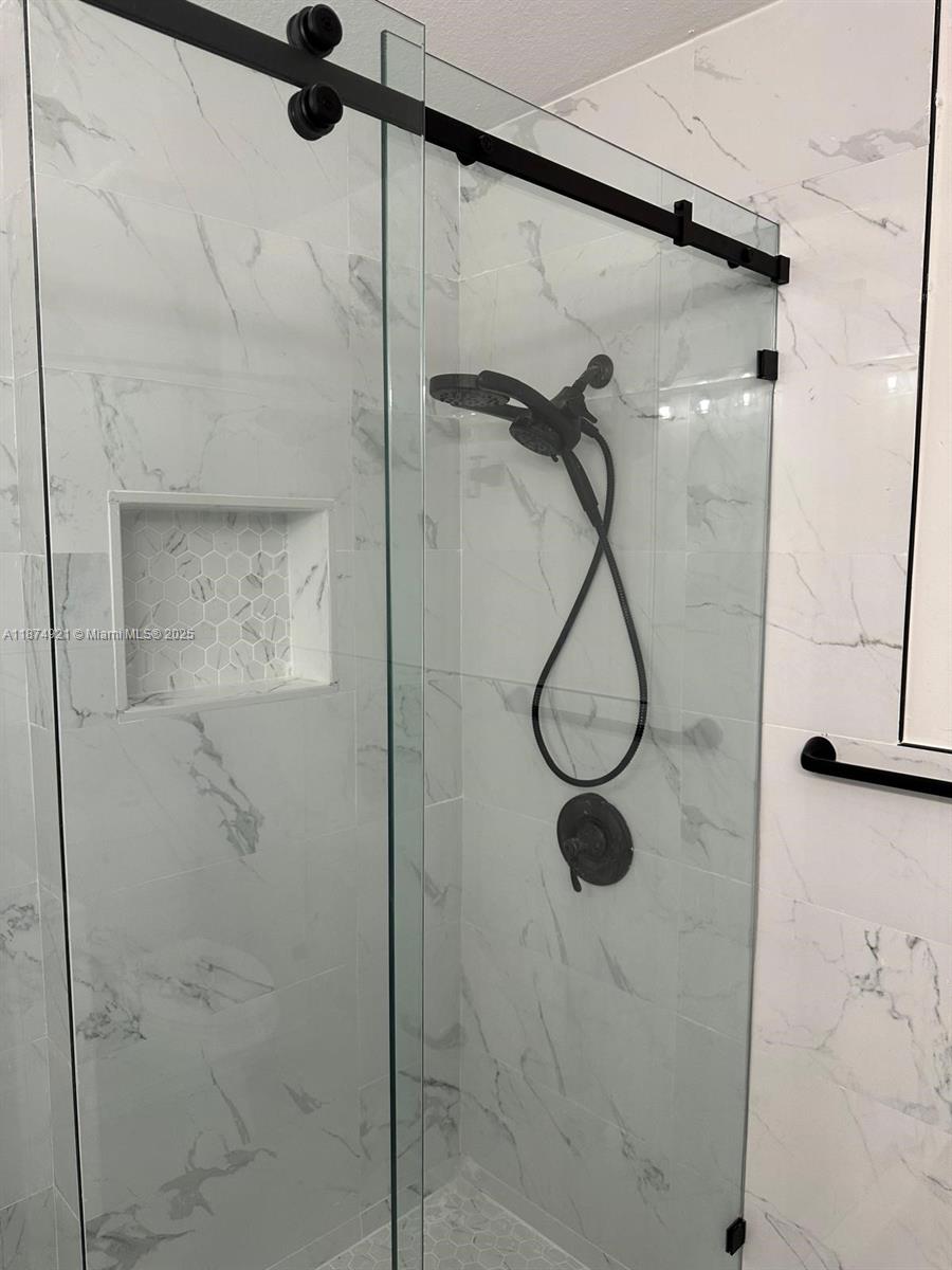 12421 Southwest 50th Court, Unit 337 Miramar, FL 33027 - Photo 26 of 46 a bathroom with a shower