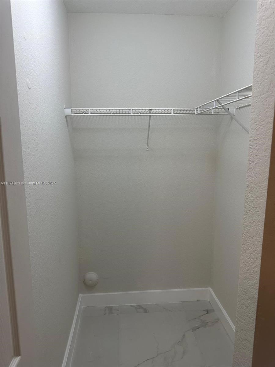 12421 Southwest 50th Court, Unit 337 Miramar, FL 33027 - Photo 33 of 46 a view of a room with racks on the wall