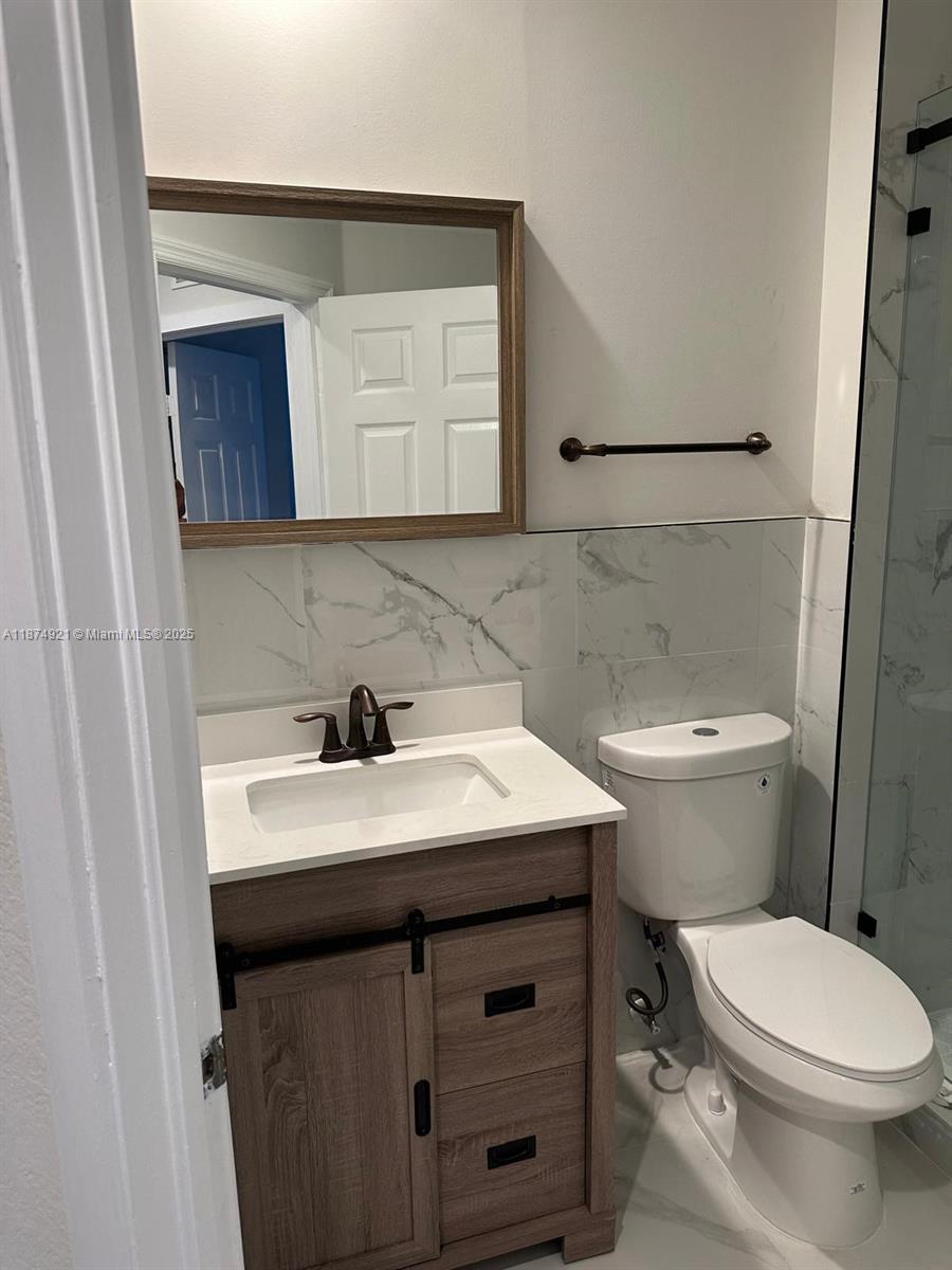 12421 Southwest 50th Court, Unit 337 Miramar, FL 33027 - Photo 35 of 46 a bathroom with a sink and a toilet