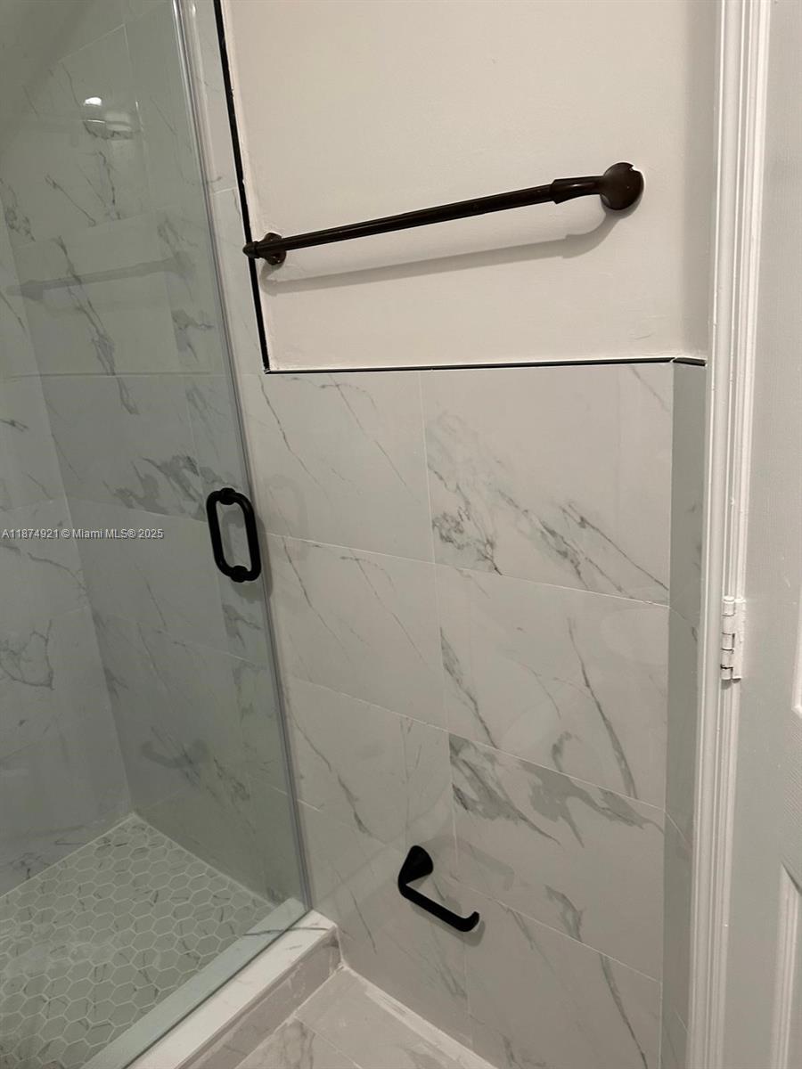 12421 Southwest 50th Court, Unit 337 Miramar, FL 33027 - Photo 37 of 46 a bathroom with a shower