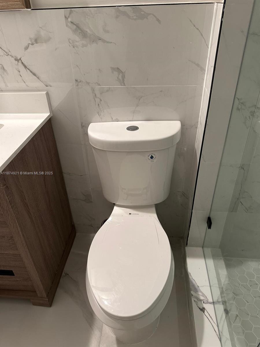 12421 Southwest 50th Court, Unit 337 Miramar, FL 33027 - Photo 40 of 46 a bathroom with a toilet and a sink