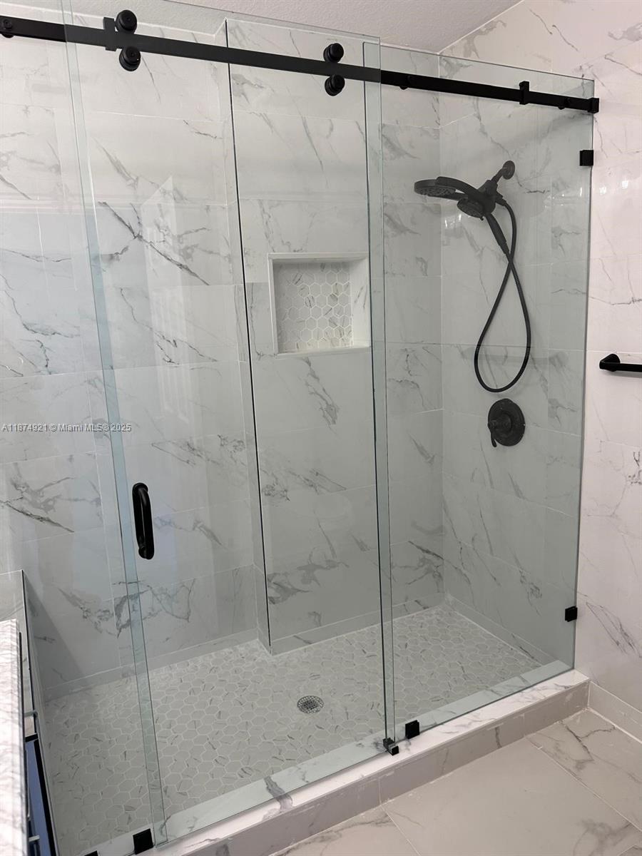 12421 Southwest 50th Court, Unit 337 Miramar, FL 33027 - Photo 42 of 46 a bathroom with a shower