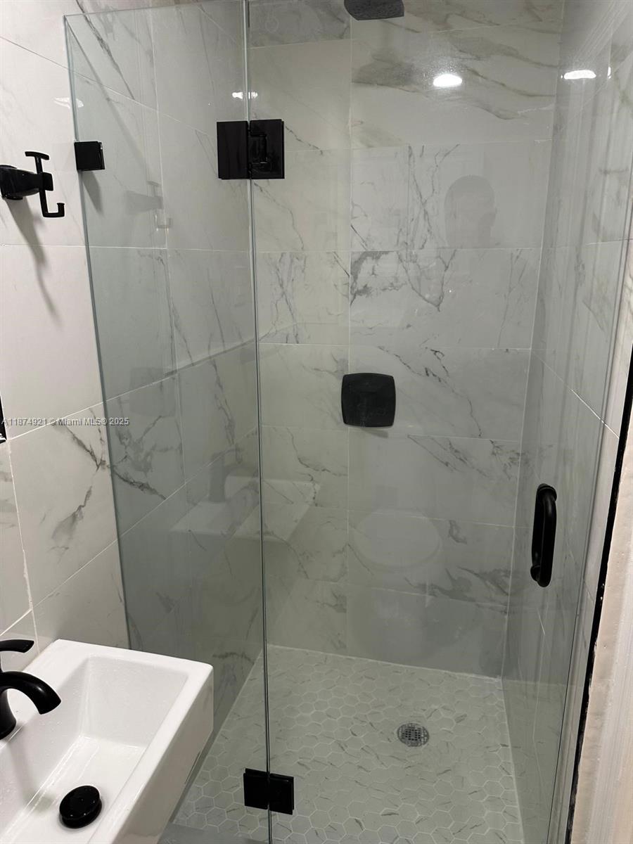 12421 Southwest 50th Court, Unit 337 Miramar, FL 33027 - Photo 46 of 46 a bathroom with a sink and a shower