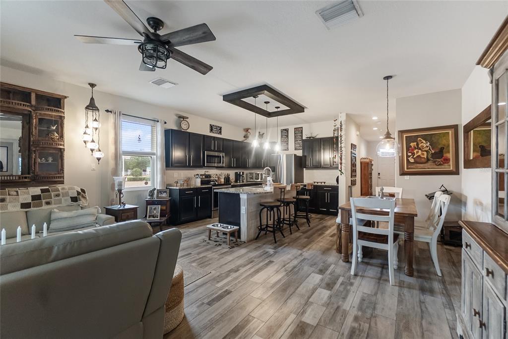 8990 Indigo Trail Loop Riverview, FL 33578 - Photo 14 of 43 a living room with furniture and a wooden floor