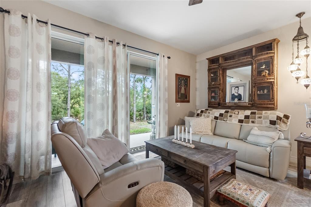 8990 Indigo Trail Loop Riverview, FL 33578 - Photo 16 of 43 a living room with furniture and a window