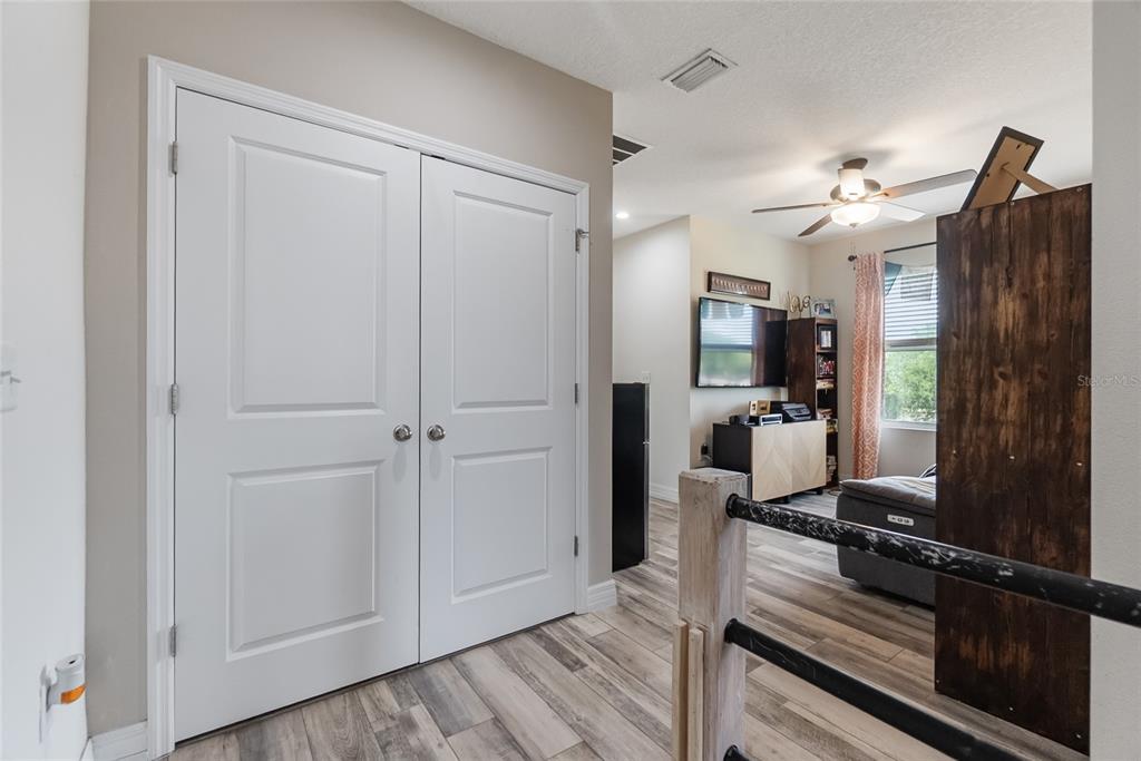 8990 Indigo Trail Loop Riverview, FL 33578 - Photo 19 of 43 a view of a kitchen from the hallway