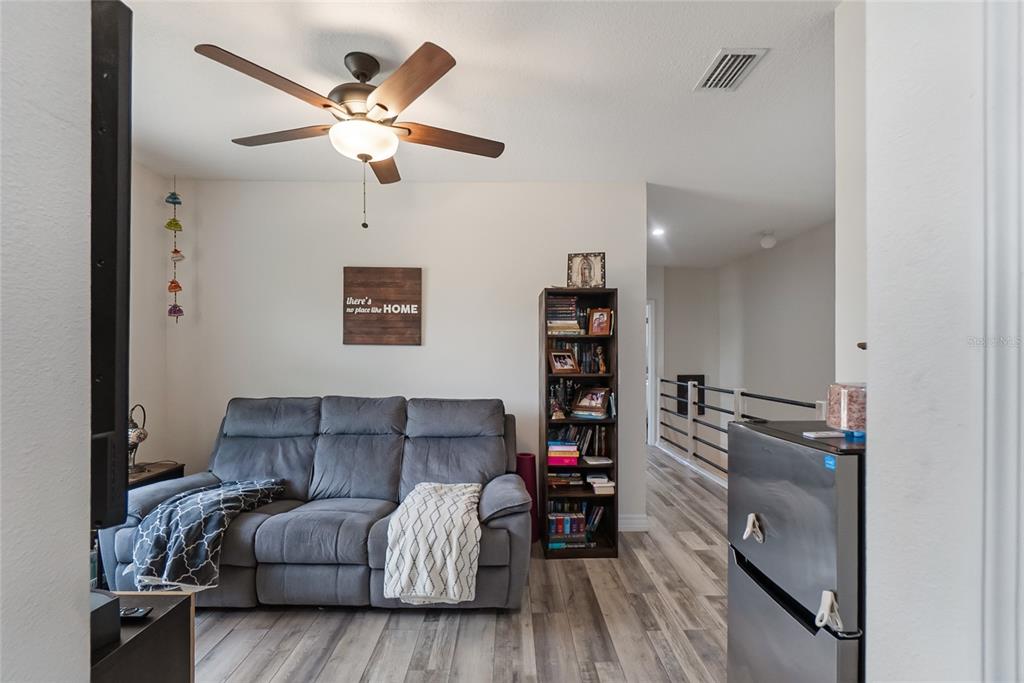 8990 Indigo Trail Loop Riverview, FL 33578 - Photo 23 of 43 a living room with furniture and a window