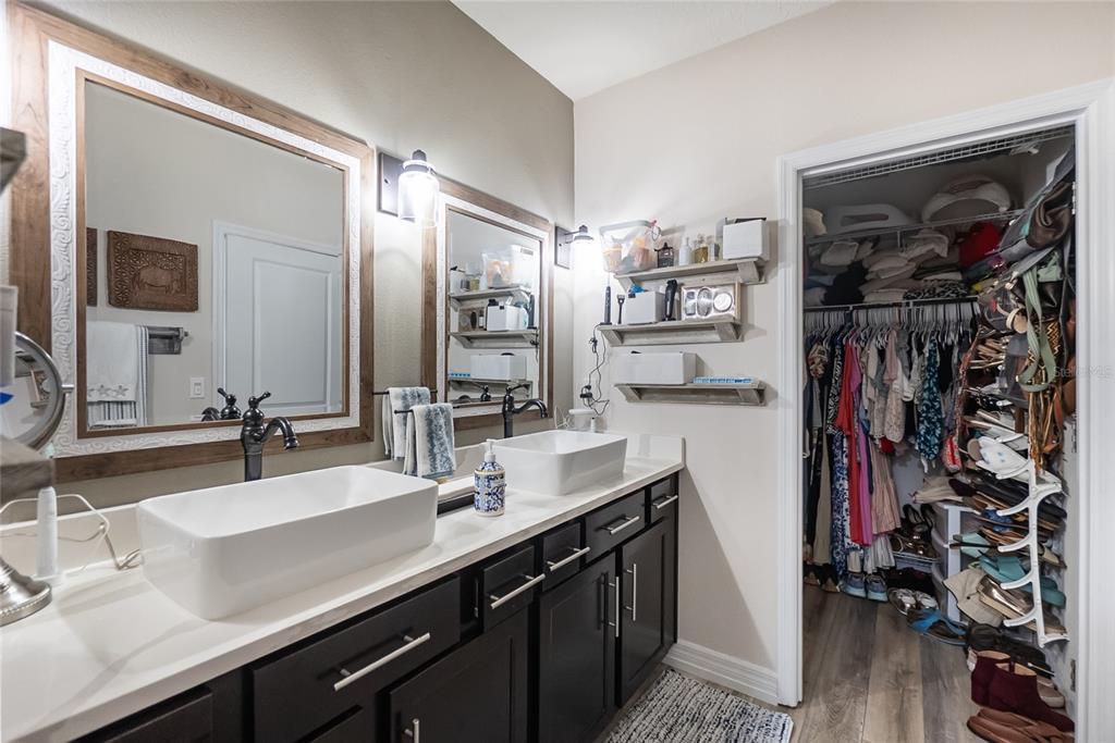 8990 Indigo Trail Loop Riverview, FL 33578 - Photo 32 of 43 a bathroom with a sink double vanity and a mirror