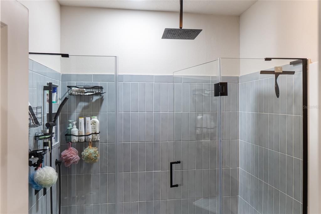 8990 Indigo Trail Loop Riverview, FL 33578 - Photo 36 of 43 a bathroom with a shower
