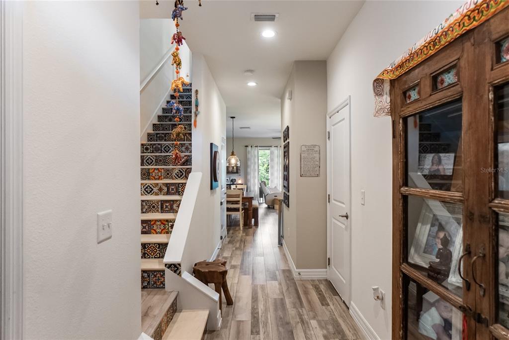 8990 Indigo Trail Loop Riverview, FL 33578 - Photo 5 of 43 a view of a hallway with wooden floor and staircase