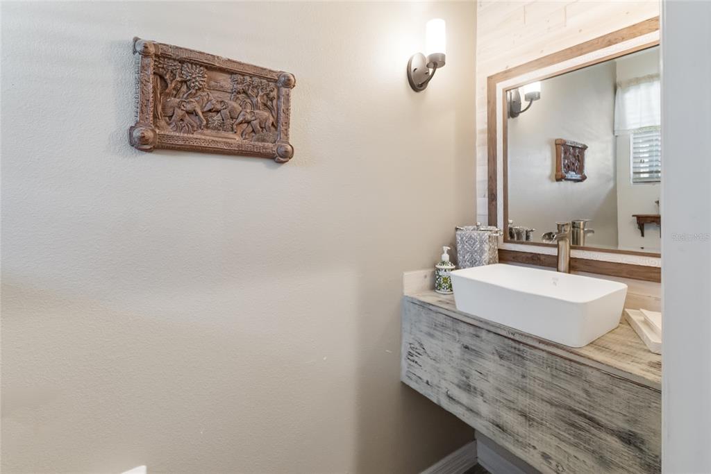 8990 Indigo Trail Loop Riverview, FL 33578 - Photo 7 of 43 a bathroom with a sink and a mirror