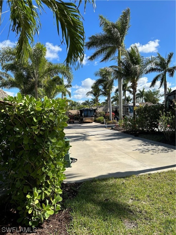 13581 Snapper Lane Naples, FL 34114 - Photo 13 of 34 a view of swimming pool with a garden