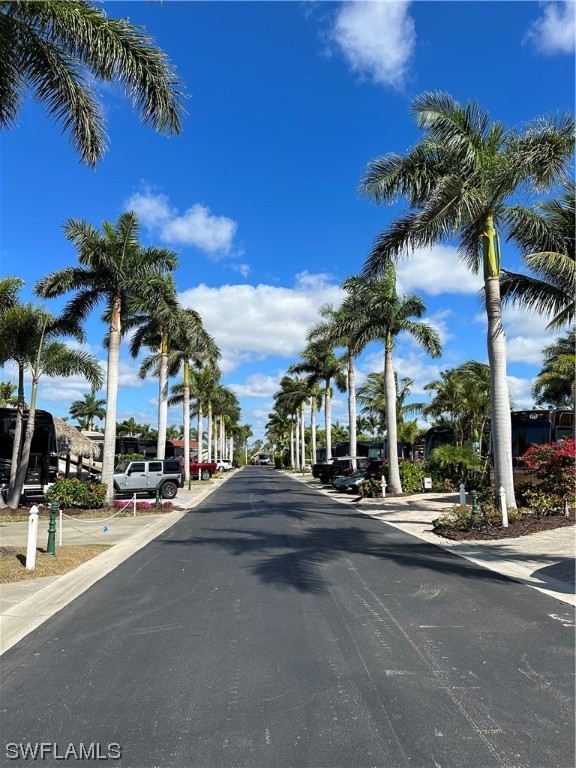 13581 Snapper Lane Naples, FL 34114 - Photo 17 of 34 a street with palm trees