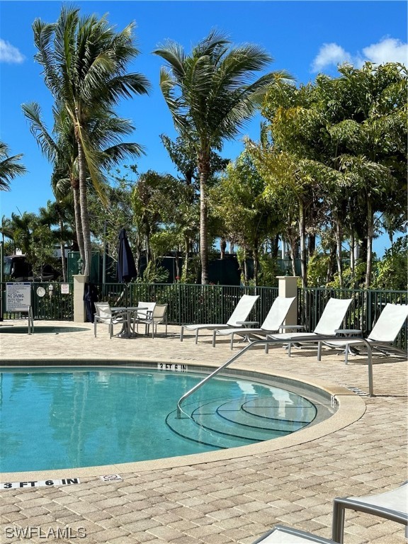 13581 Snapper Lane Naples, FL 34114 - Photo 20 of 34 a view of a swimming pool with a house