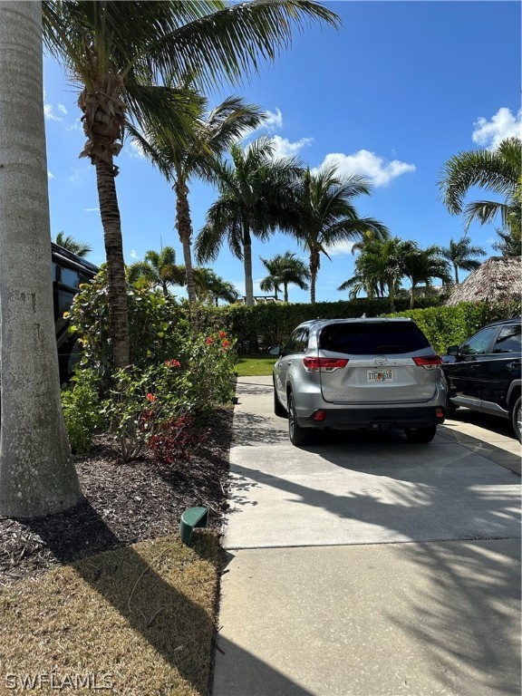 13581 Snapper Lane Naples, FL 34114 - Photo 30 of 34 a view of a yard with cars parked on the roadside