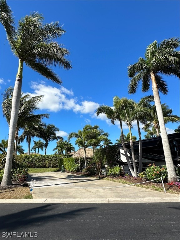 13581 Snapper Lane Naples, FL 34114 - Photo 4 of 34 a view of a street with a building in the background