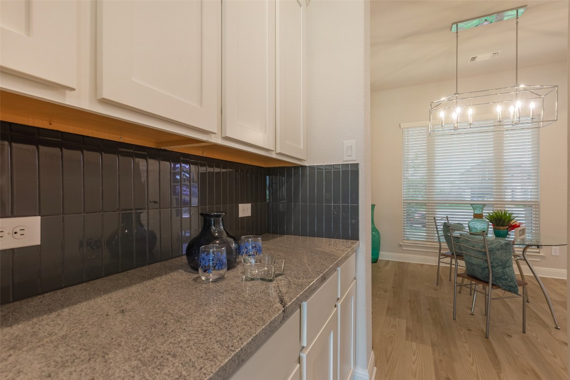 103 Periwinkle Lane Bastrop, TX 78602 - Photo 28 of 35 a kitchen with a sink cabinets and window