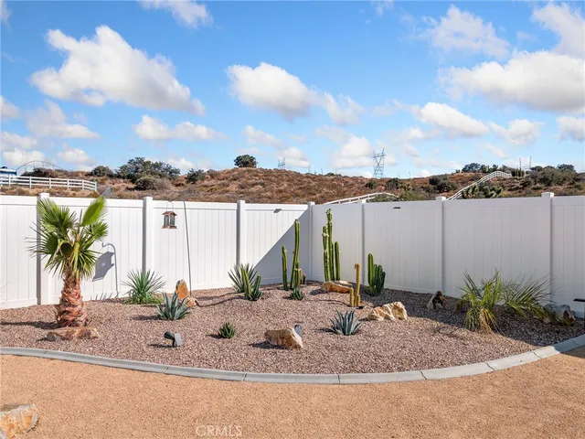 a view of a hallway with bedroom and balcony
