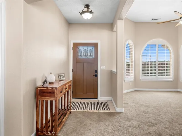a view of workspace with furniture and a window