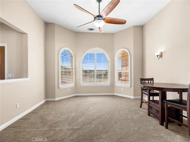 a bathroom with a tub a double vanity sink and mirror