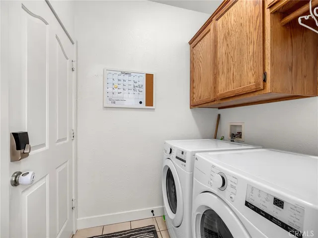 an aerial view of a houses with city view