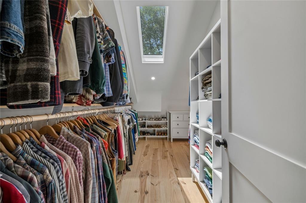 2069 Edinburgh Terrace Northeast Atlanta, GA 30307 - Photo 35 of 72 a view of walk in closet with clothes and shoes