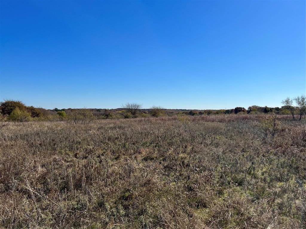 Tbd Tbd Cr-2117 Gainesville, TX 76240 - Photo 23 of 35 a view of a large building with mountains in the background