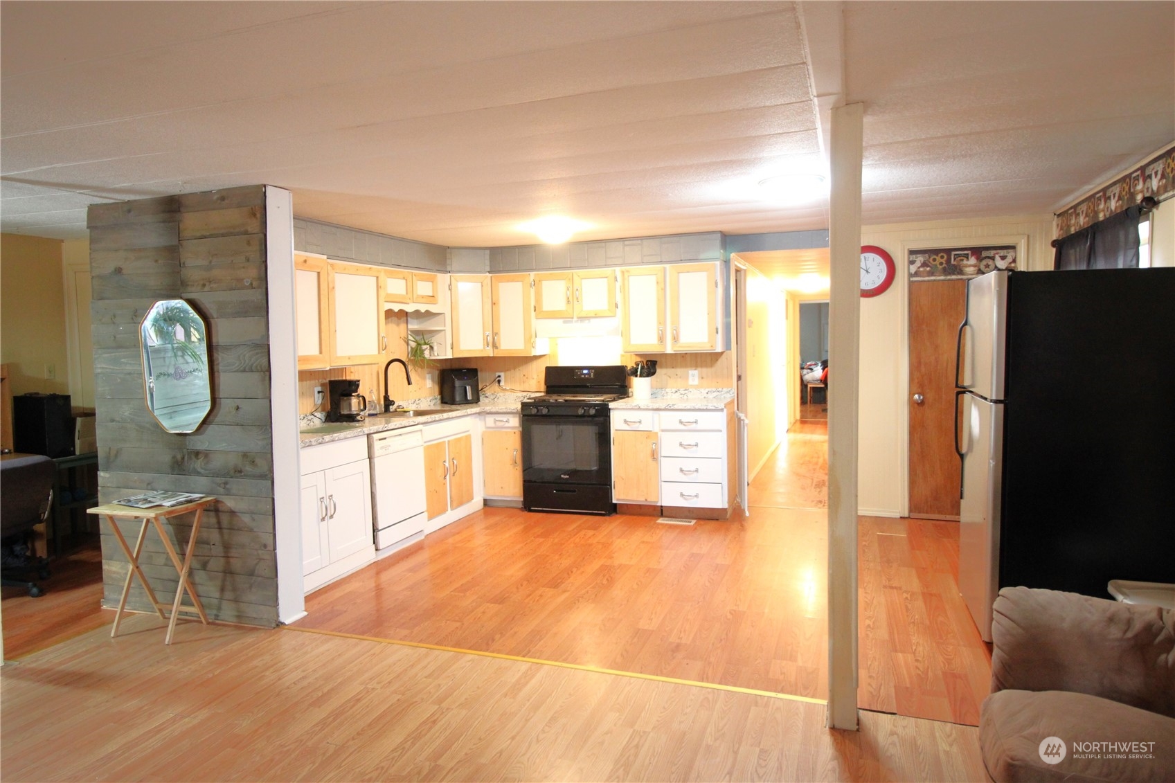 11410 Riverside Drive Southeast Olympia, WA 98513 - Photo 2 of 19 a kitchen with stainless steel appliances granite countertop a refrigerator and a stove top oven