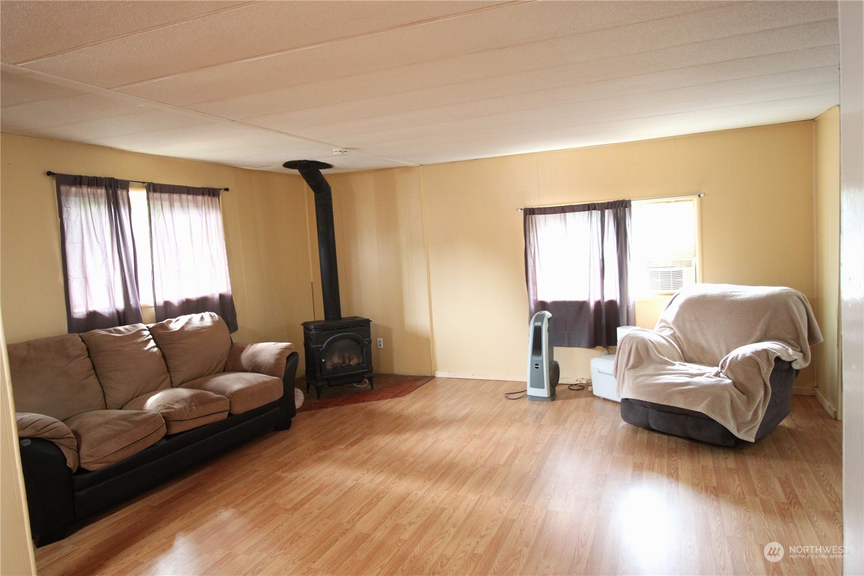 11410 Riverside Drive Southeast Olympia, WA 98513 - Photo 6 of 19 a living room with furniture and a large window