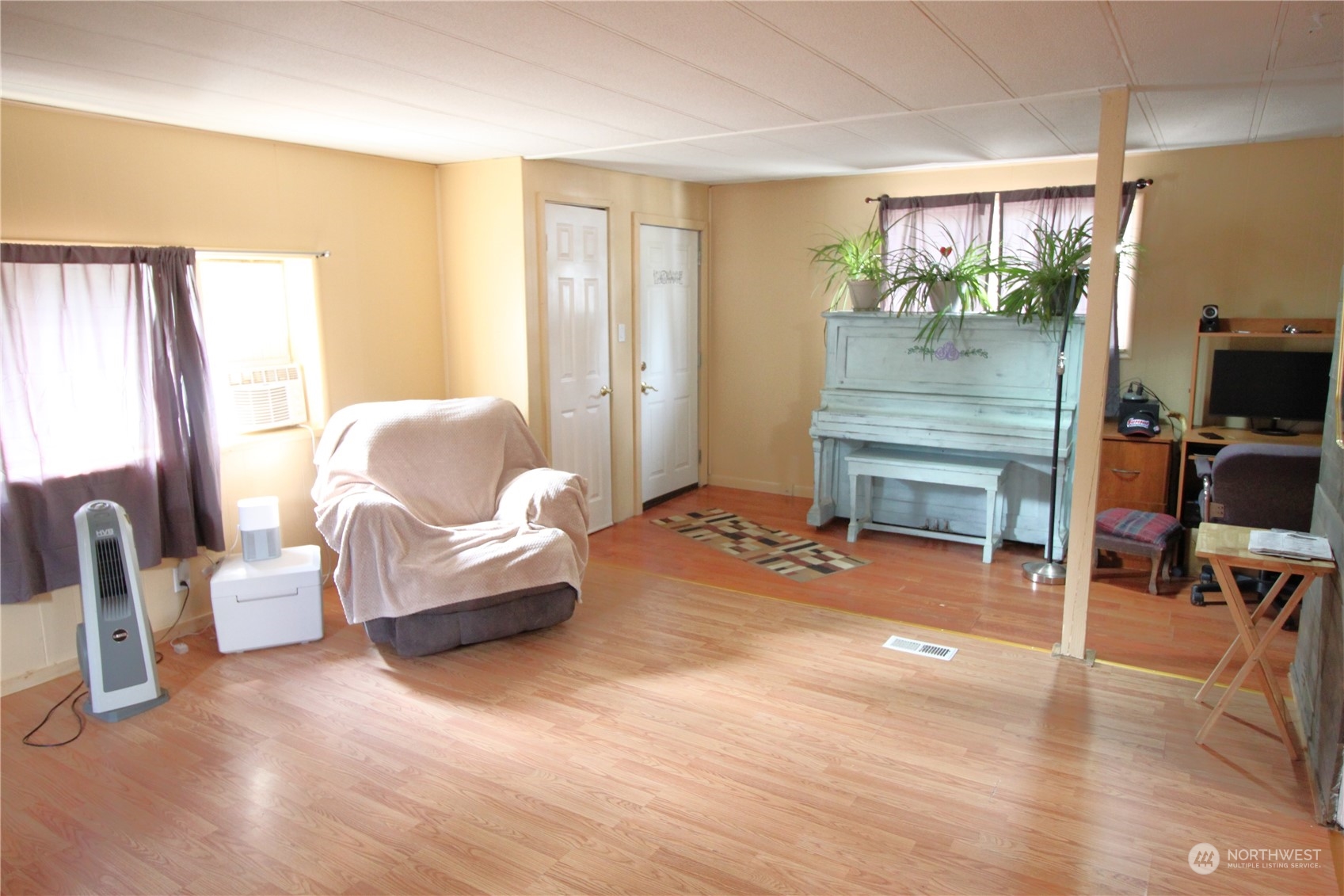 11410 Riverside Drive Southeast Olympia, WA 98513 - Photo 7 of 19 a living room with furniture and a flat screen tv