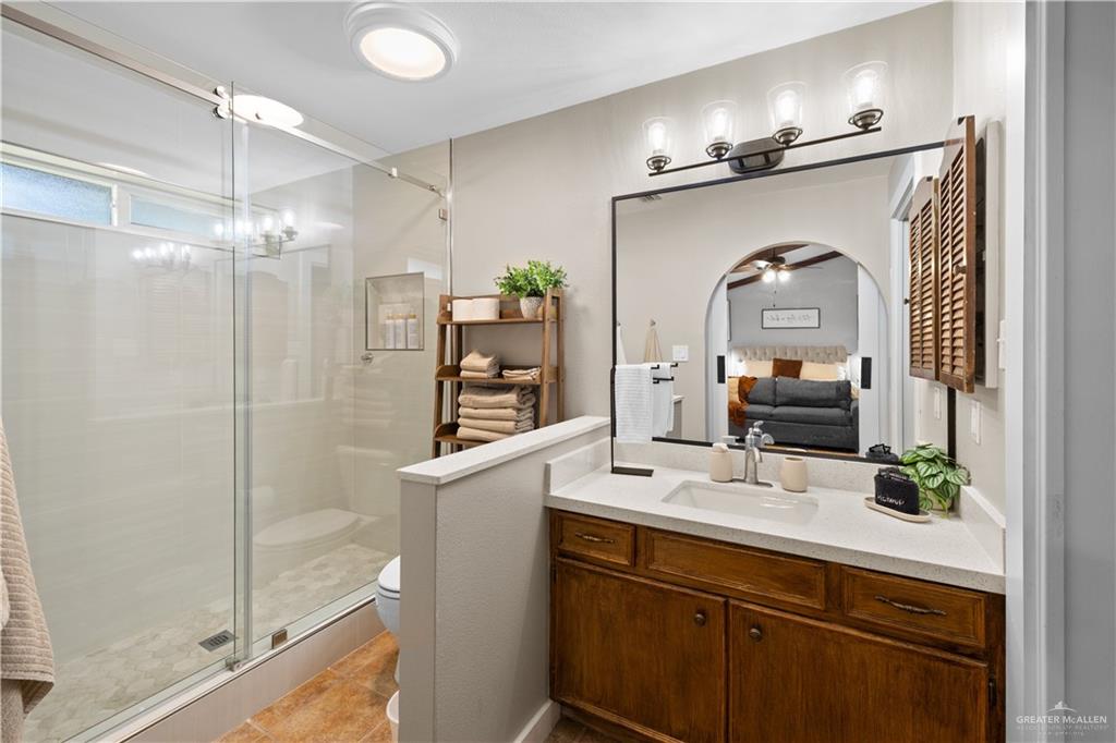 2212 North Bryan Rd Mission Mission, TX 78572 - Photo 18 of 44 a bathroom with a sink a mirror and a shower
