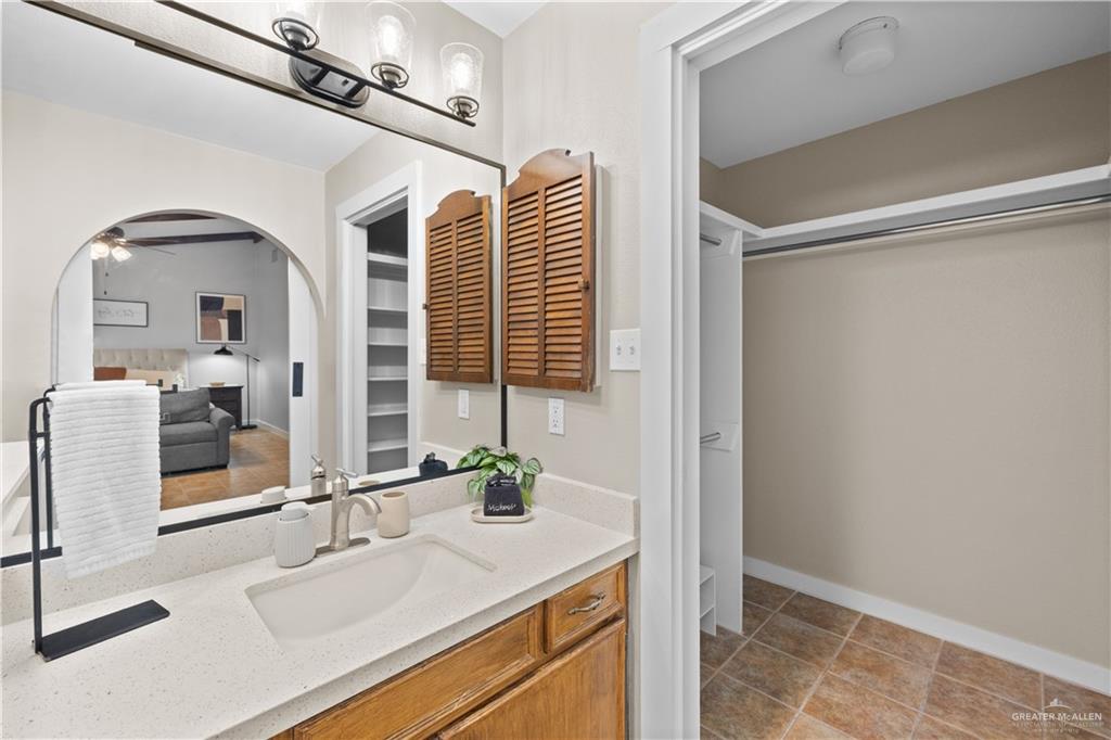 2212 North Bryan Rd Mission Mission, TX 78572 - Photo 19 of 44 a bathroom with a sink and a mirror