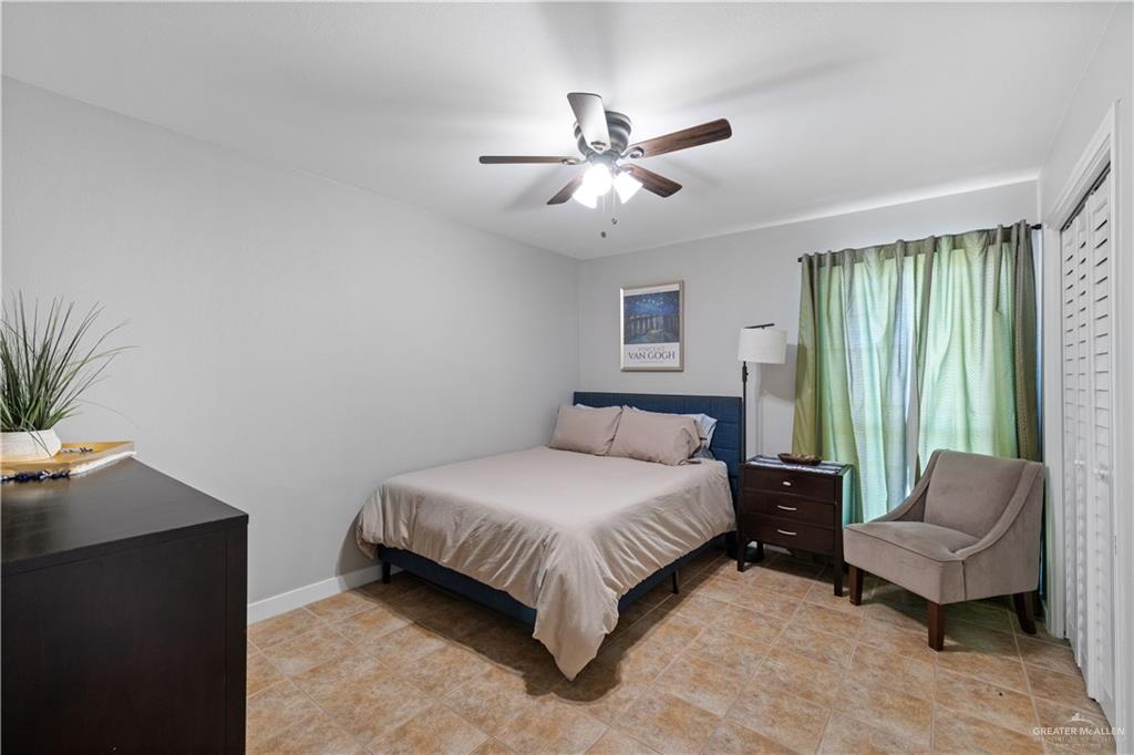 2212 North Bryan Rd Mission Mission, TX 78572 - Photo 20 of 44 a bedroom with a bed couch and a window