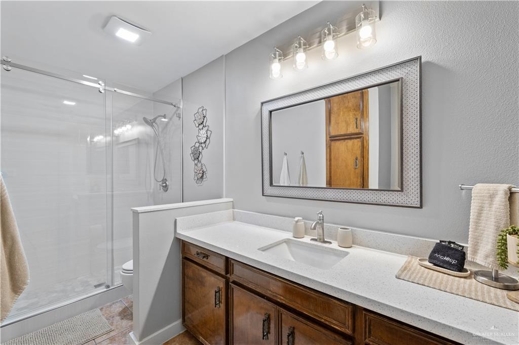 2212 North Bryan Rd Mission Mission, TX 78572 - Photo 23 of 44 a bathroom with a sink double vanity and a mirror