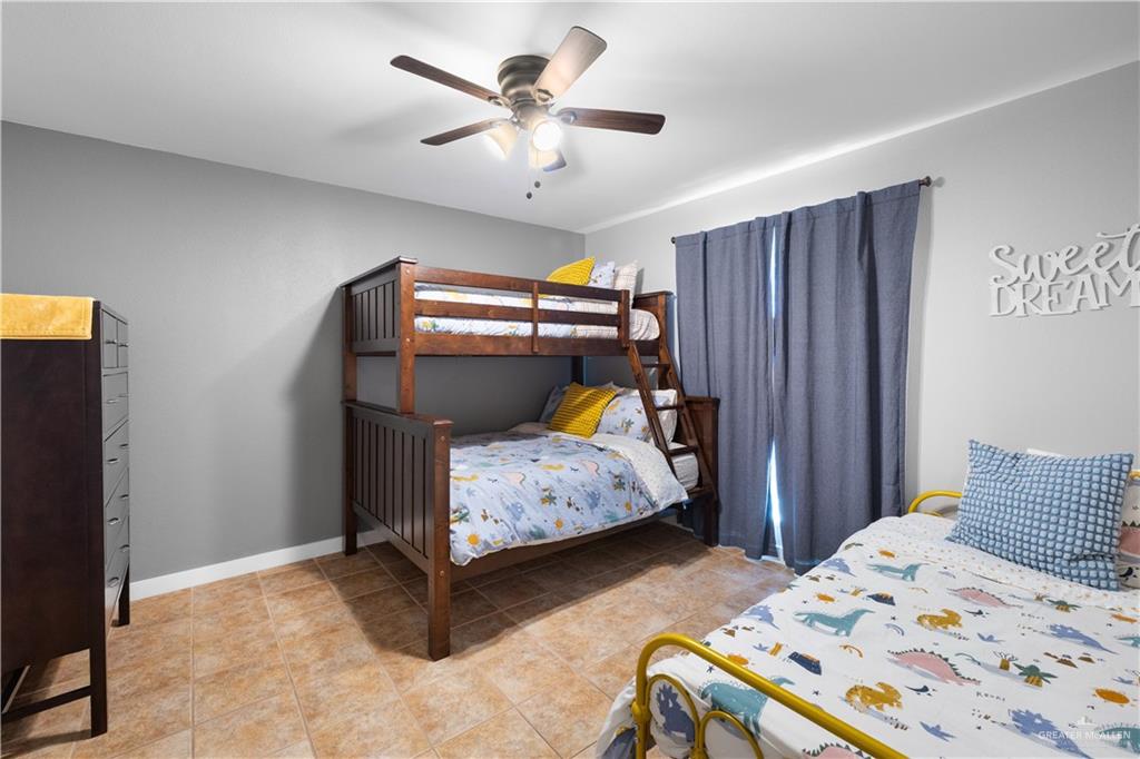 2212 North Bryan Rd Mission Mission, TX 78572 - Photo 24 of 44 a bedroom with bed and wooden furniture