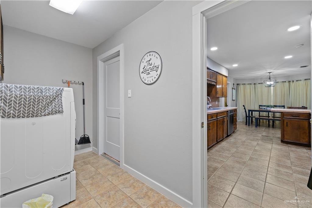 2212 North Bryan Rd Mission Mission, TX 78572 - Photo 25 of 44 a view of a kitchen with fridge and wooden floor