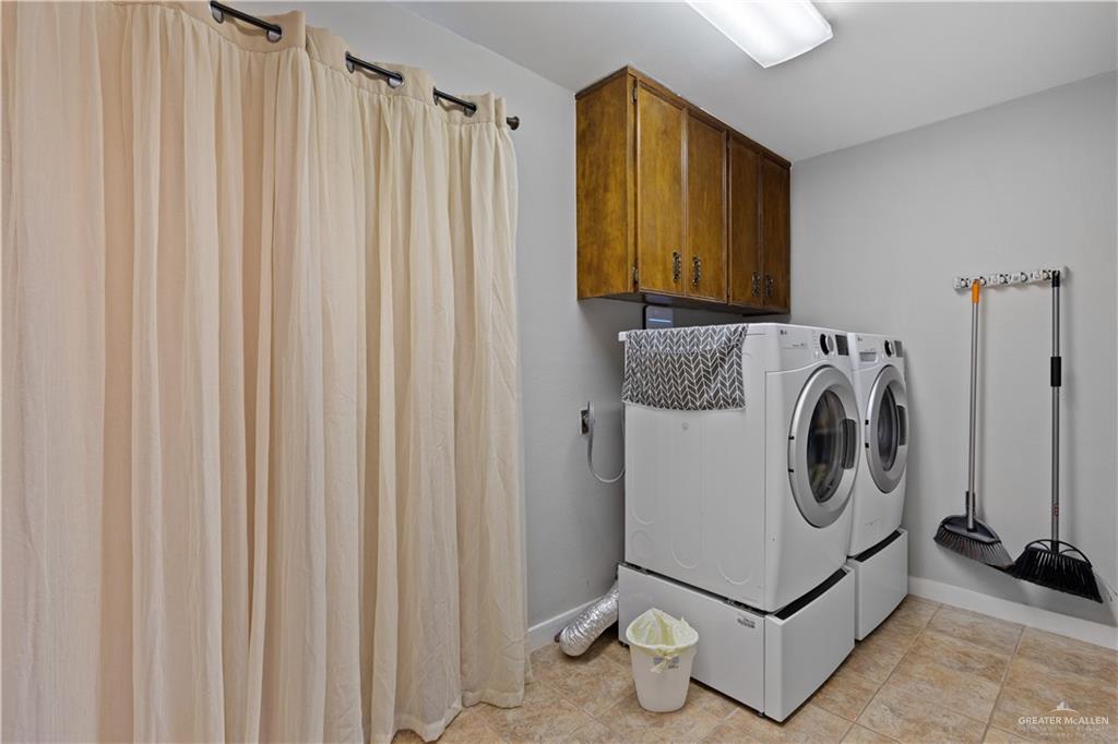 2212 North Bryan Rd Mission Mission, TX 78572 - Photo 26 of 44 a utility room with dryer and washer