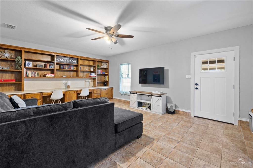 2212 North Bryan Rd Mission Mission, TX 78572 - Photo 29 of 44 a living room with furniture and a flat screen tv